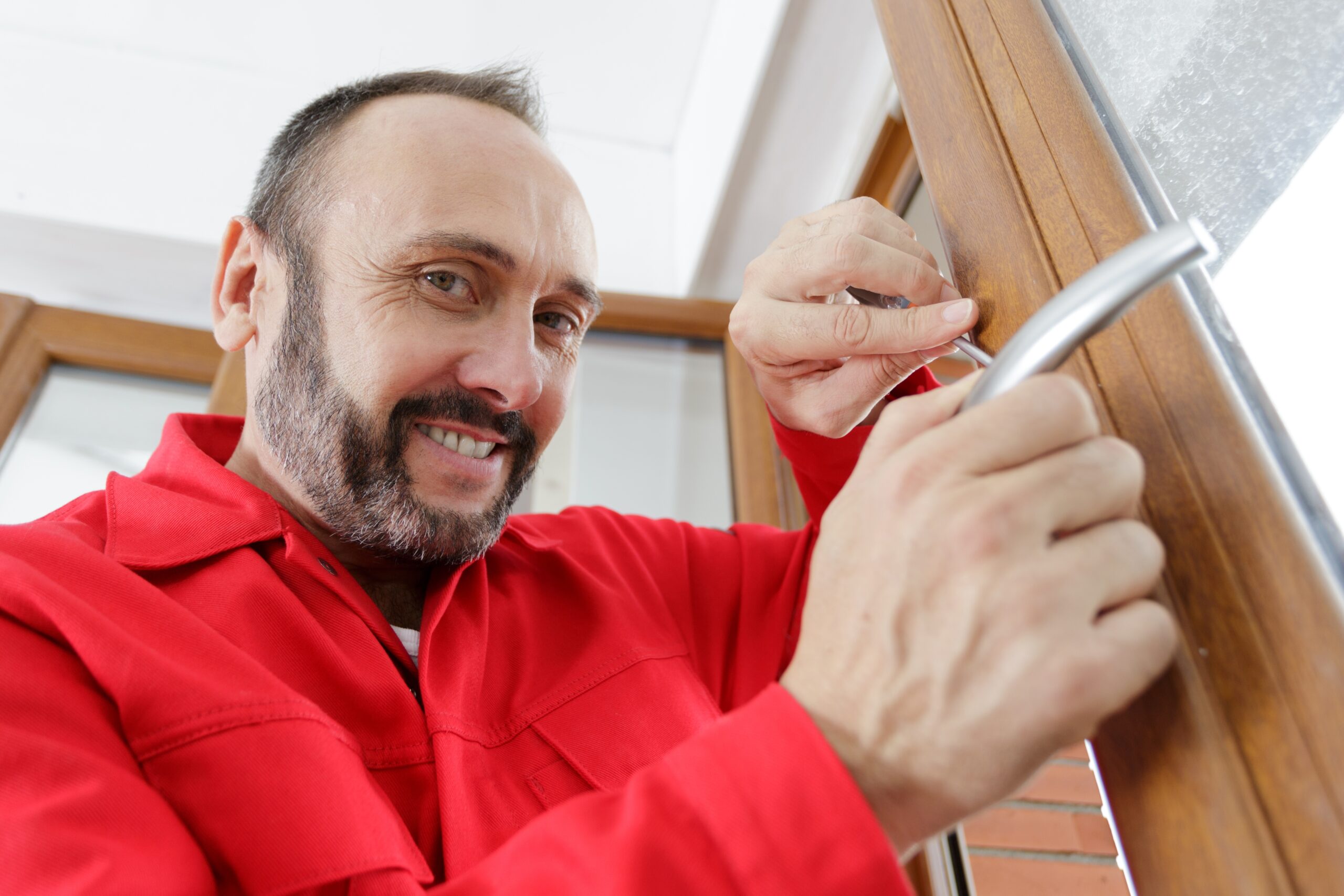 Portrait,Of,Mature,Professional,Locksmith,At,Work